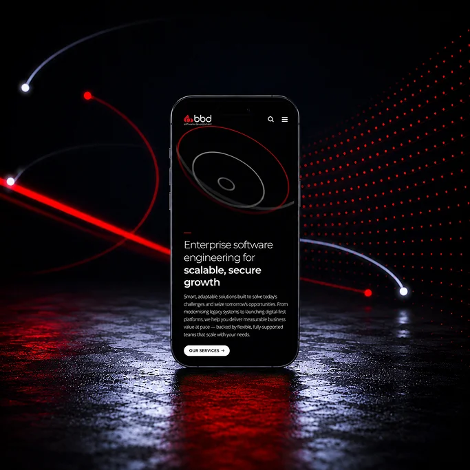 Smartphone displaying a website for enterprise software engineering with striking red and white light effects in the