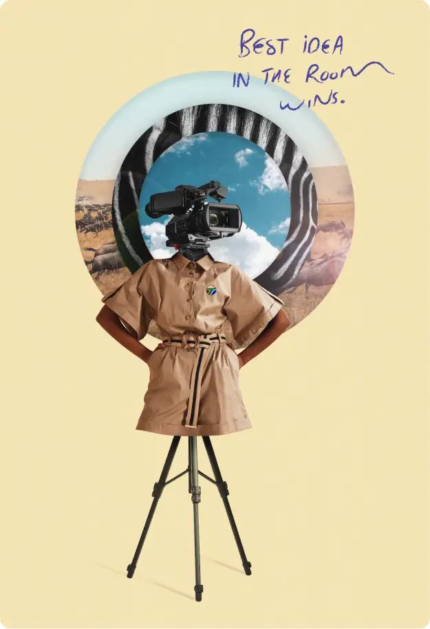 Person in a beige outfit stands confidently with a video camera on a tripod, framed by a colorful circular backdrop.