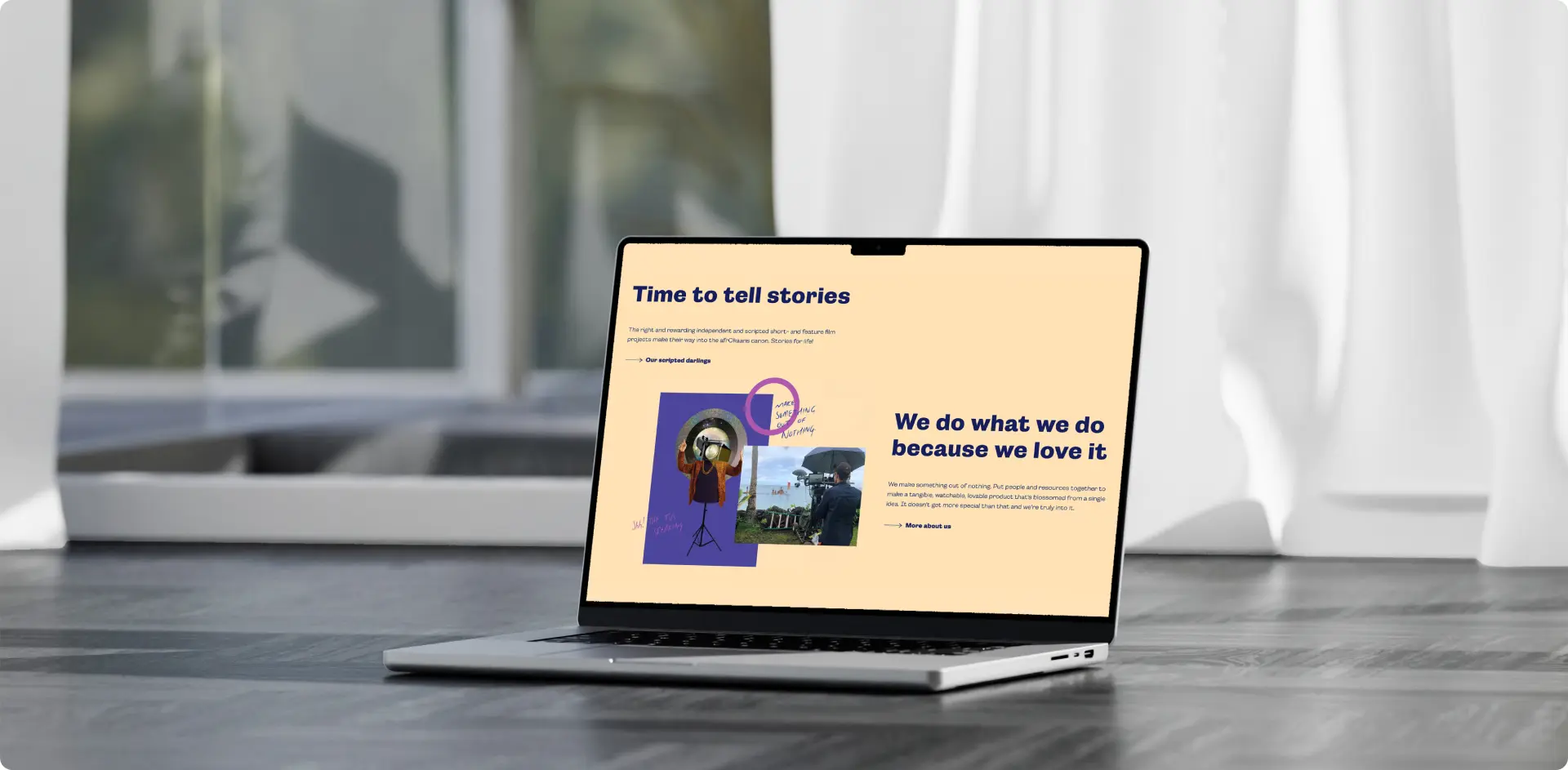 Laptop placed on the floor displaying a colorful presentation about storytelling and passion.