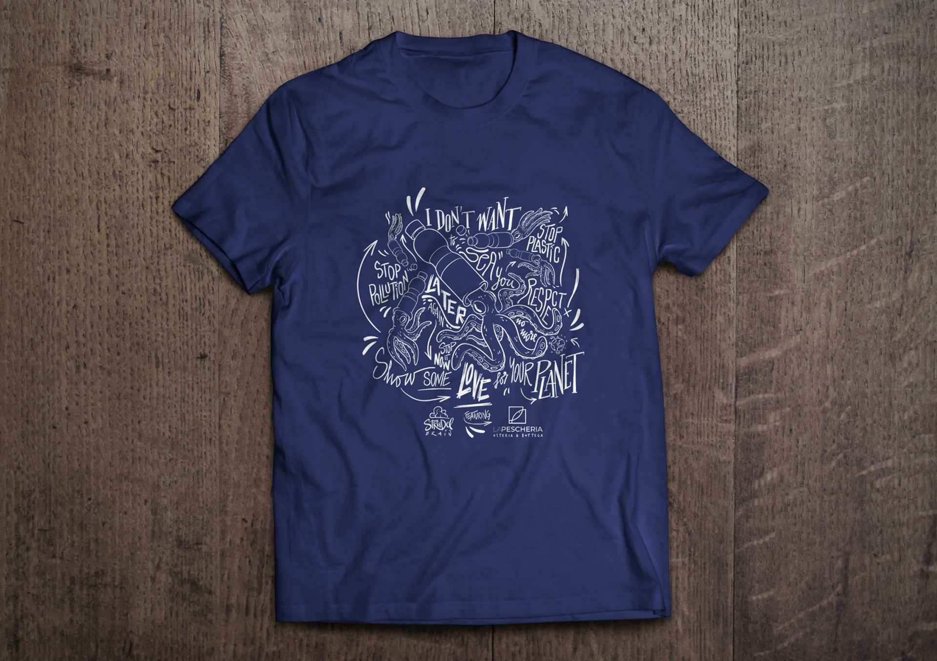 Navy t-shirt featuring a detailed graphic print of a seafood-themed design.