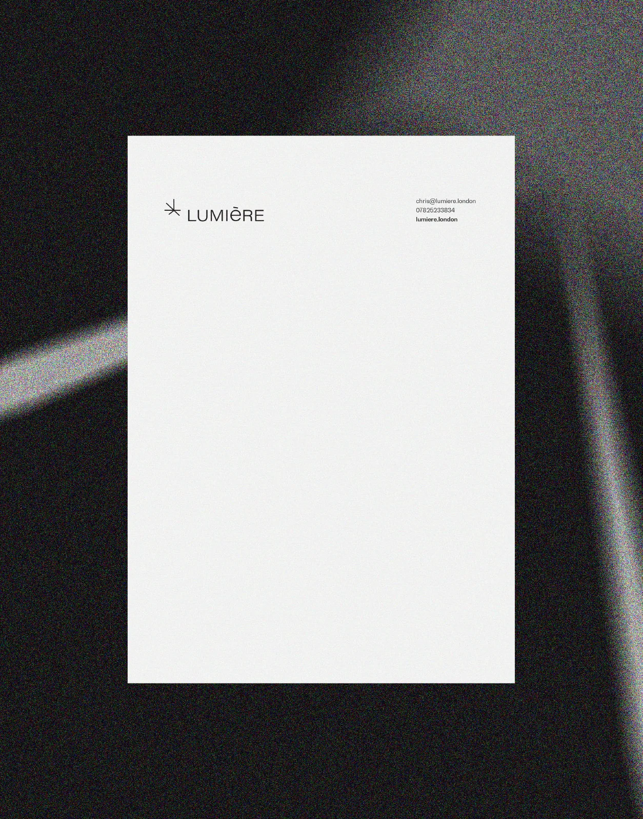 Blank white document with a logo and text header for Lumière, set against a black background with light rays.