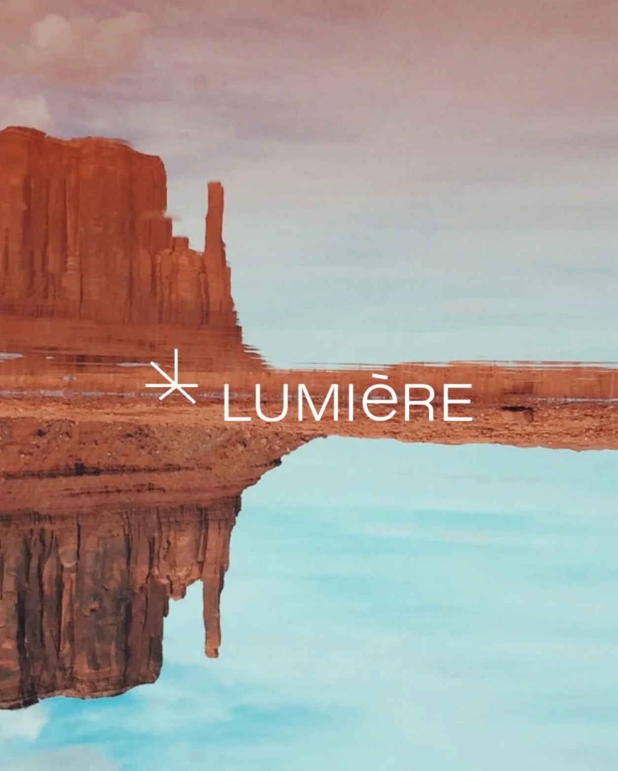 Desert landscape with a reflective water surface and the word "LUMIÈRE" prominently displayed.