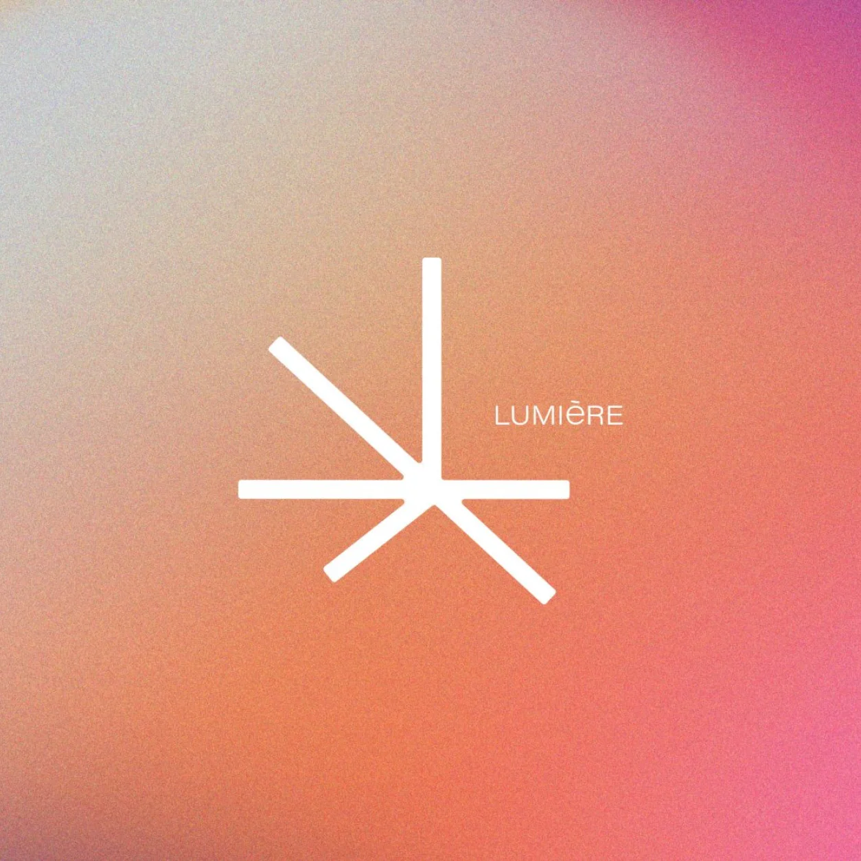 Stylized white logo of "Lumière" on a soft gradient background of orange and pink hues.